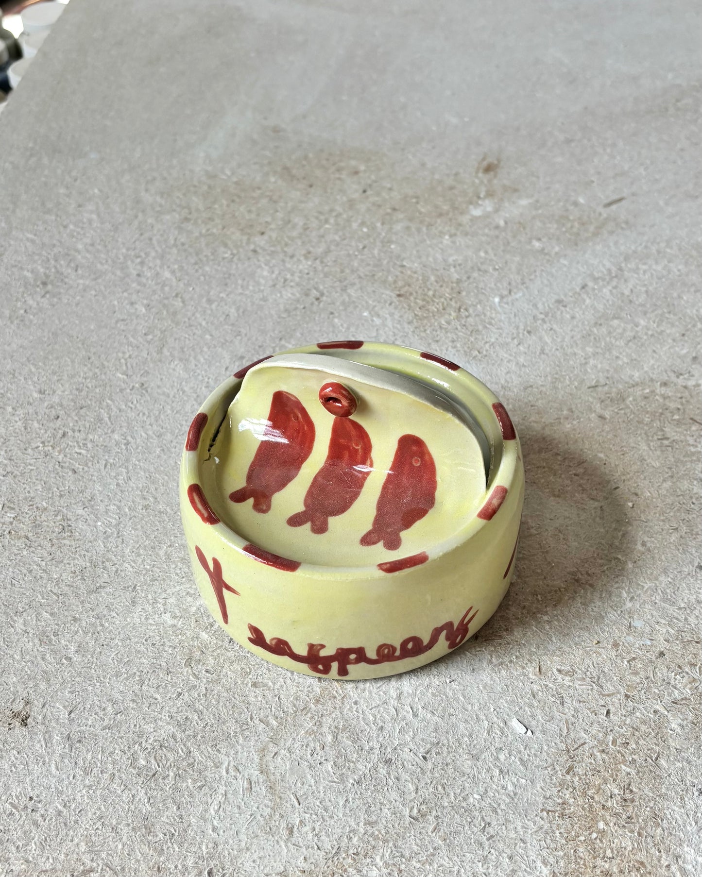 yellow and red sardine tin + spoons