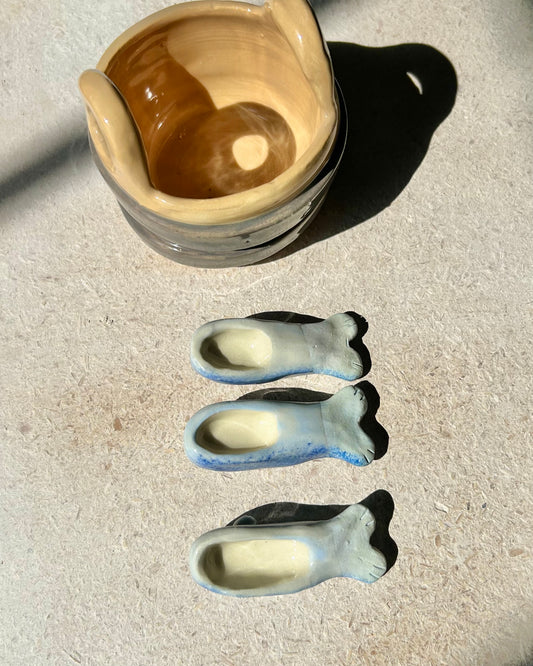 sardine spoons in a bucket