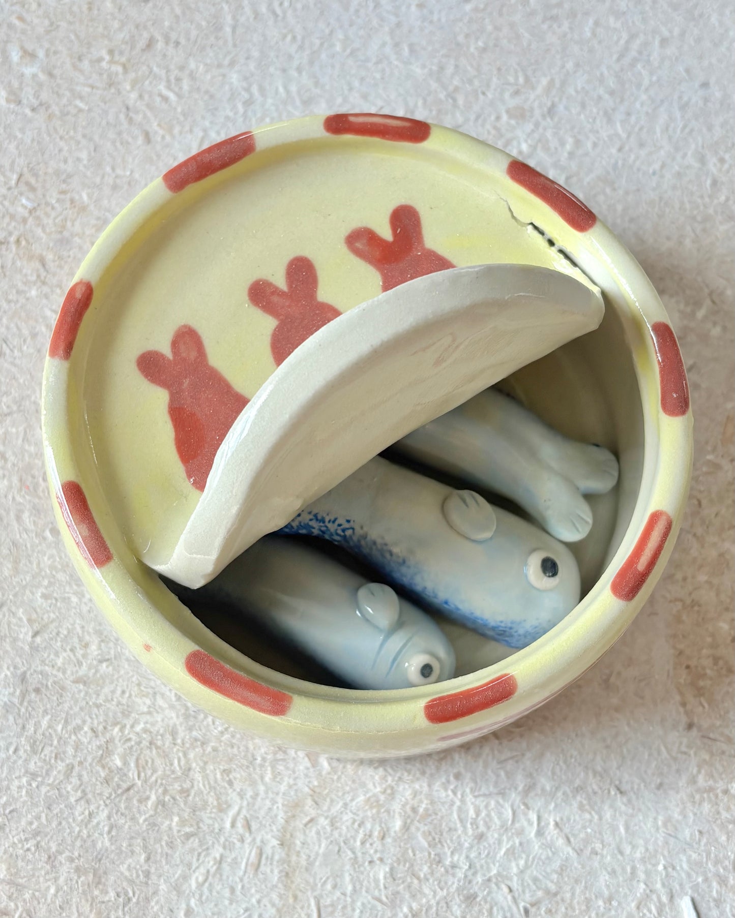 yellow and red sardine tin + spoons